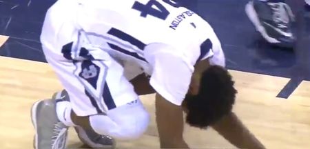 College player crashes on his arse after strong dunk