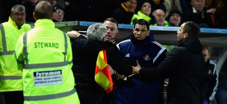 WATCH: Linesman has to restrain Steve Bruce as he tries to get at Gus Poyet after heated exchange