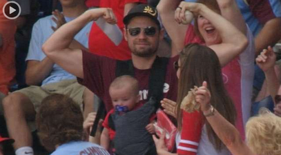 Video: Baseball fan catches foul ball one handed with a baby strapped to his chest