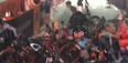 WATCH: Motorcycle stalls, causes absolutely huge bicycle pile-up