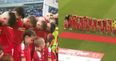 Cliftonville players keep their heads bowed during God Save the Queen before Irish Cup final against Coleraine