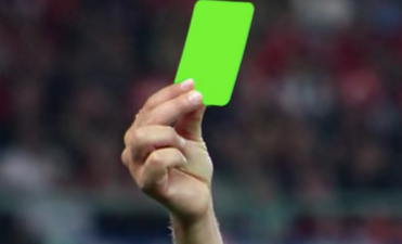 Referee issues first ever green card in a football match