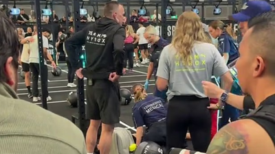Hyrox athlete completes race while girlfriend is treated by paramedics sparking huge debate
